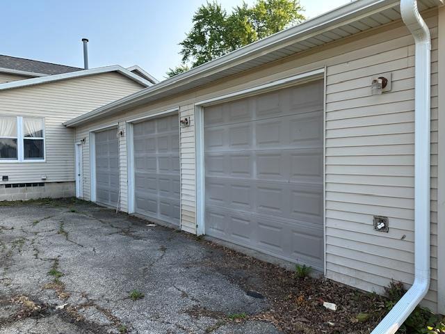 420 Jackson St, Waupun, WI 53963 - garage featuring asphalt driveway