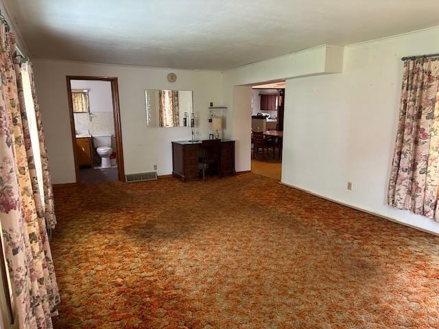 420 Jackson St, Waupun, WI 53963 - unfurnished living room featuring carpet flooring