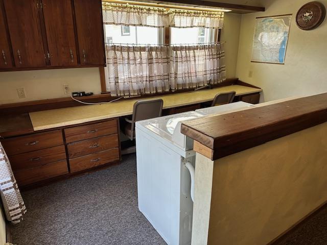 420 Jackson St, Waupun, WI 53963 - office area featuring built in study area and dark colored carpet