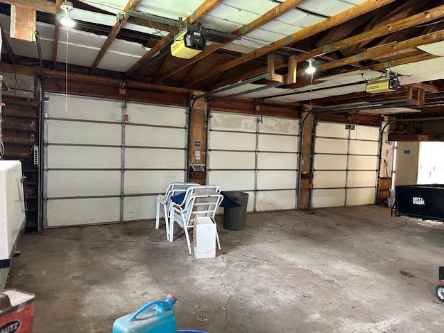 420 Jackson St, Waupun, WI 53963 - garage featuring a garage door opener