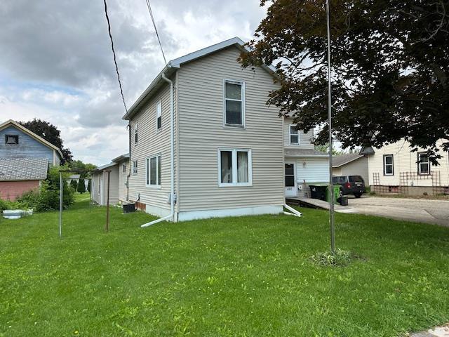 420 Jackson St, Waupun, WI 53963 - view of front of property featuring a front lawn