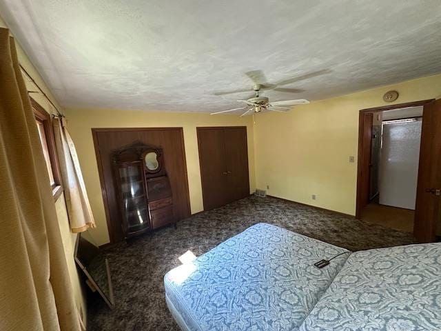 420 Jackson St, Waupun, WI 53963 - unfurnished bedroom with carpet flooring, multiple closets, and ceiling fan