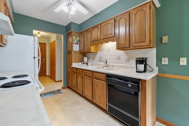 530 N Silverbrook Dr Unit 121, West Bend, WI 53090 - kitchen with white appliances, a ceiling fan, backsplash, light countertops, and exhaust hood