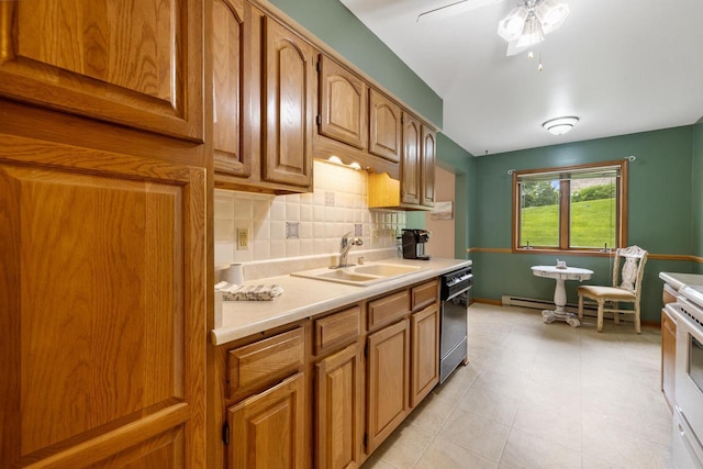 530 N Silverbrook Dr Unit 121, West Bend, WI 53090 - kitchen featuring dishwashing machine, light countertops, decorative backsplash, brown cabinetry, and ceiling fan