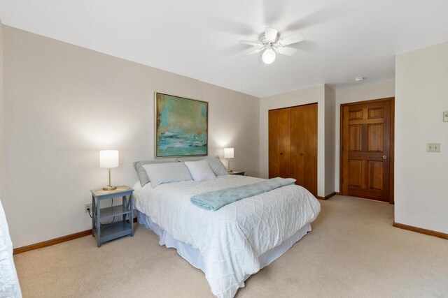 530 N Silverbrook Dr Unit 121, West Bend, WI 53090 - bedroom featuring light carpet, a closet, and ceiling fan