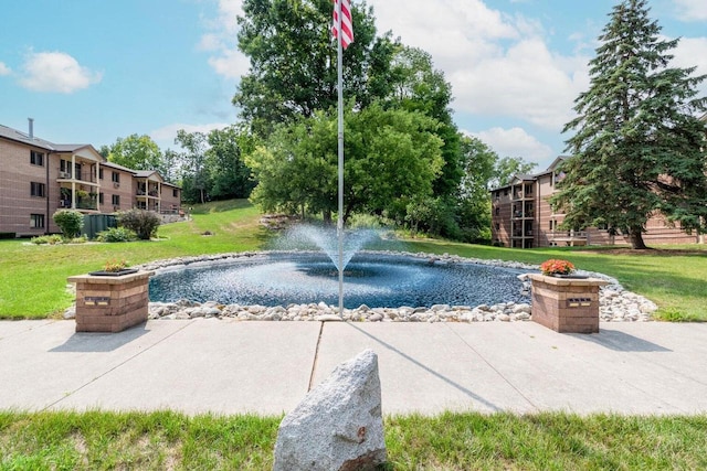 530 N Silverbrook Dr Unit 121, West Bend, WI 53090 - view of swimming pool with a yard