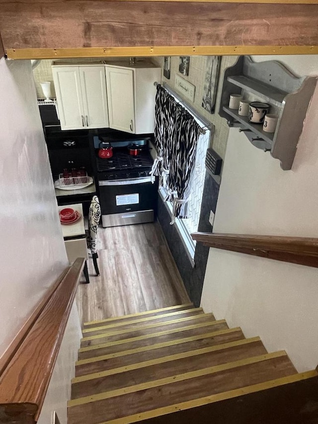 3915 N 23rd St, Milwaukee, WI 53206 - staircase with wood finished floors