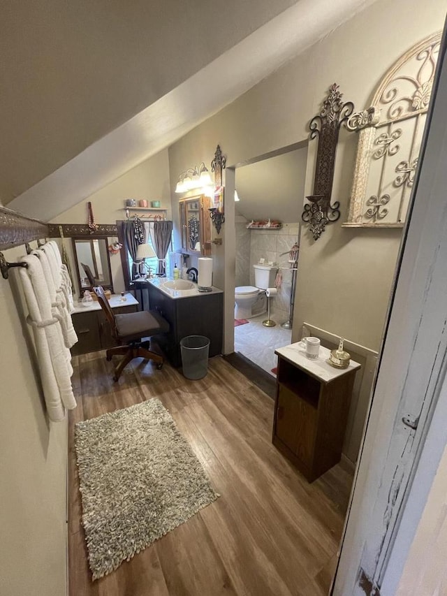 3915 N 23rd St, Milwaukee, WI 53206 - full bath with wood finished floors, vanity, a bidet, and lofted ceiling
