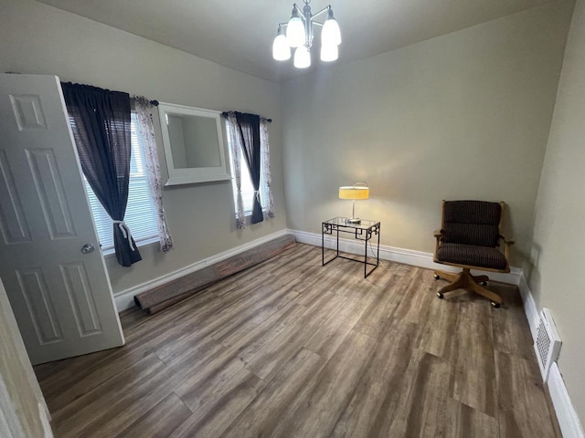 3915 N 23rd St, Milwaukee, WI 53206 - sitting room featuring wood finished floors and a chandelier