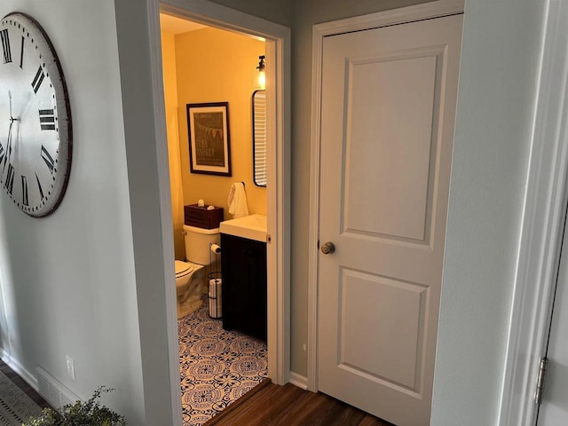 342 E Chapel Royal Dr, Verona, WI 53593 - hallway with dark wood-type flooring and baseboards