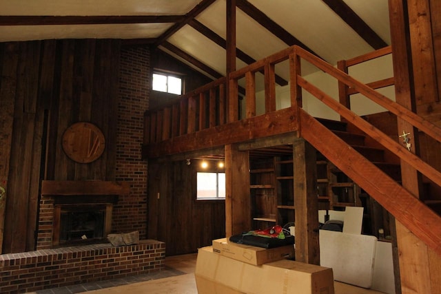 4726 N Green Bay Rd, Racine, WI 53404 - unfurnished living room featuring wooden walls and a brick fireplace
