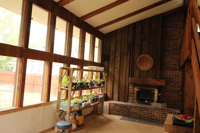 4726 N Green Bay Rd, Racine, WI 53404 - living area featuring wood walls, a brick fireplace, and high vaulted ceiling