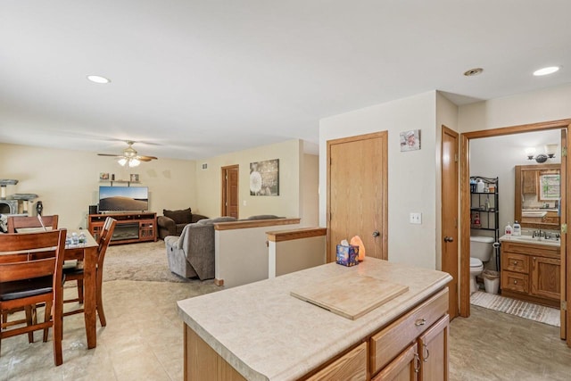 34116 Valley Dr, Burlington, WI 53105 - kitchen featuring ceiling fan, a kitchen island, light countertops, and recessed lighting