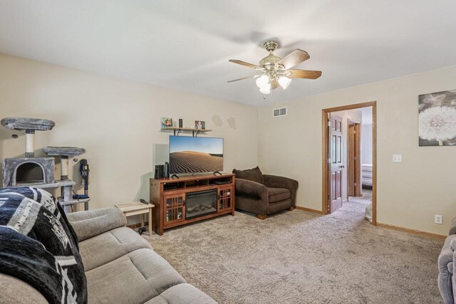 34116 Valley Dr, Burlington, WI 53105 - carpeted living area featuring a ceiling fan and baseboards