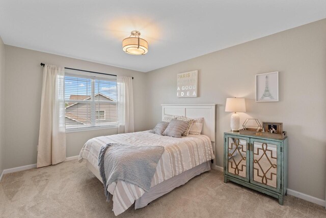 6028 Star Grass Ln, Racine, WI 53406 - carpeted bedroom with baseboards