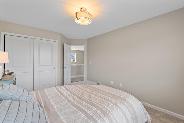 6028 Star Grass Ln, Racine, WI 53406 - carpeted bedroom with baseboards and a closet