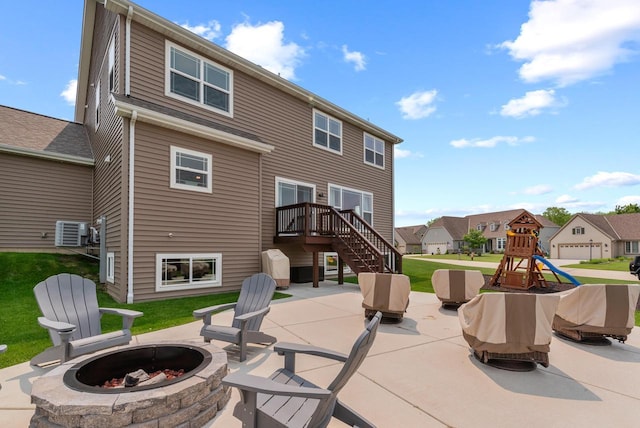 6028 Star Grass Ln, Racine, WI 53406 - view of patio featuring a fire pit, a residential view, a playground, and stairway