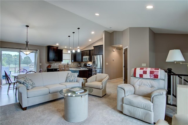 964 S Kelly Rd, Ellsworth, WI 54011 - living area with recessed lighting, light colored carpet, and high vaulted ceiling
