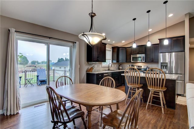 964 S Kelly Rd, Ellsworth, WI 54011 - dining space with lofted ceiling and dark wood-style flooring