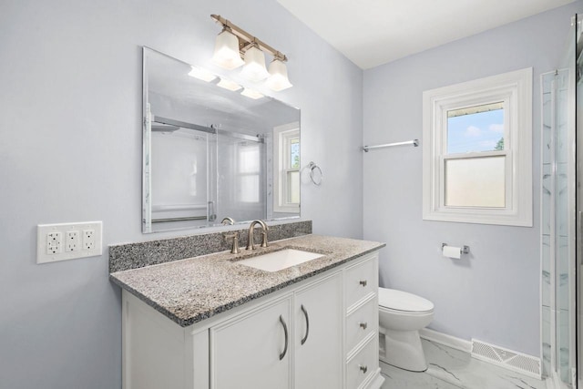 2711 Hyacinth Ave, Janesville, WI 53545 - full bathroom featuring vanity, an enclosed shower, and marble finish floors
