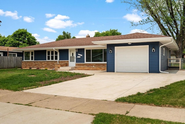 2711 Hyacinth Ave, Janesville, WI 53545 - ranch-style house with a garage, a chimney, driveway, and brick siding