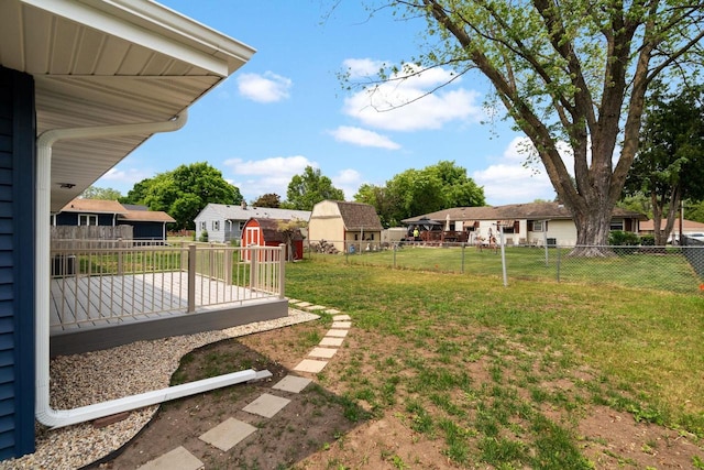 2711 Hyacinth Ave, Janesville, WI 53545 - fenced backyard with a storage shed and a wooden deck