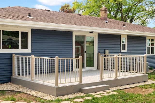 2711 Hyacinth Ave, Janesville, WI 53545 - back of property with a chimney, a shingled roof, and a deck