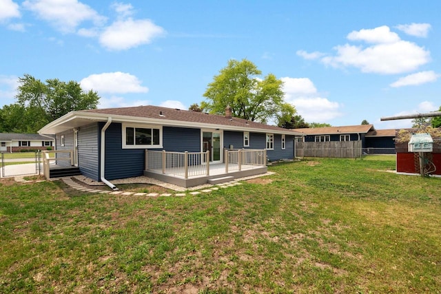 2711 Hyacinth Ave, Janesville, WI 53545 - rear view of house with a wooden deck, a gate, and a chimney