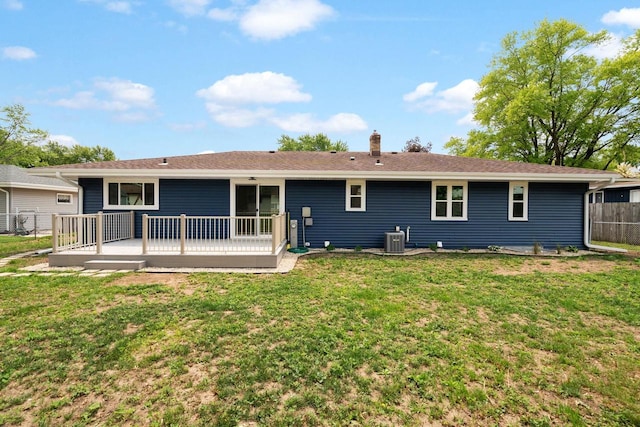 2711 Hyacinth Ave, Janesville, WI 53545 - back of house featuring a chimney and a wooden deck