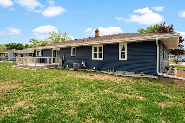 2711 Hyacinth Ave, Janesville, WI 53545 - back of house featuring a chimney and a wooden deck