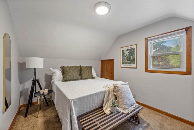 7838 N Sherman Blvd, Brown Deer, WI 53209 - carpeted bedroom featuring vaulted ceiling and arched walkways