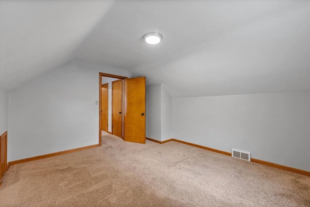 7838 N Sherman Blvd, Brown Deer, WI 53209 - additional living space with carpet flooring and vaulted ceiling
