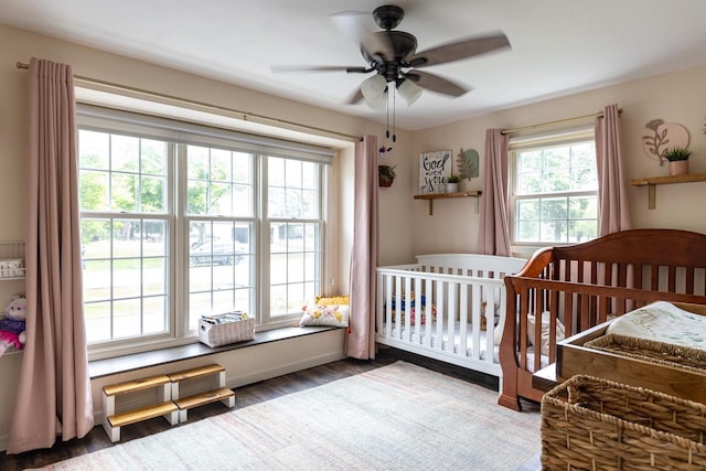 11 Meadowbrook Ct, Appleton, WI 54914 - bedroom with wood finished floors, a nursery area, and a ceiling fan
