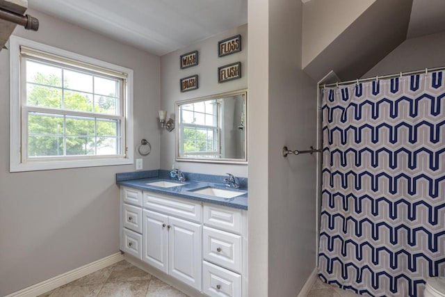 11 Meadowbrook Ct, Appleton, WI 54914 - bathroom featuring double vanity and a shower with curtain