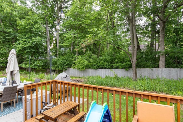 11 Meadowbrook Ct, Appleton, WI 54914 - wooden deck with outdoor dining space and a fenced backyard