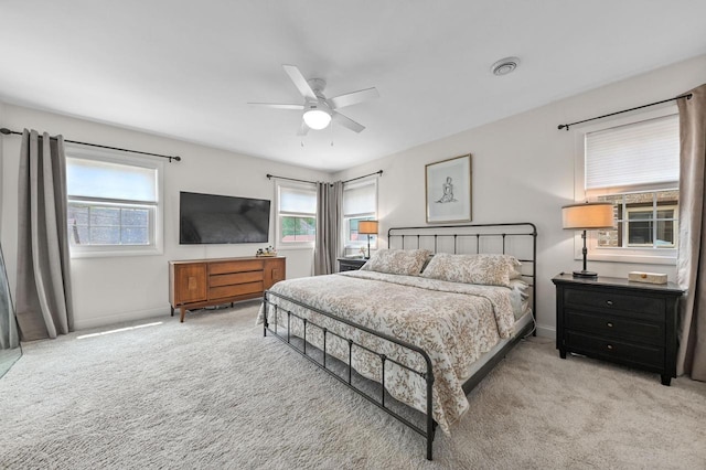 6223 W Wisconsin Ave, Wauwatosa, WI 53213 - carpeted bedroom featuring multiple windows and ceiling fan
