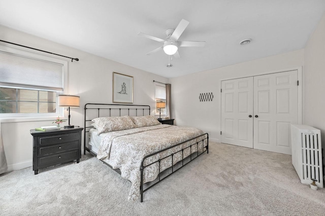 6223 W Wisconsin Ave, Wauwatosa, WI 53213 - carpeted bedroom with radiator, a closet, and a ceiling fan