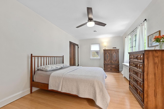 6223 W Wisconsin Ave, Wauwatosa, WI 53213 - bedroom featuring light wood-style flooring and ceiling fan