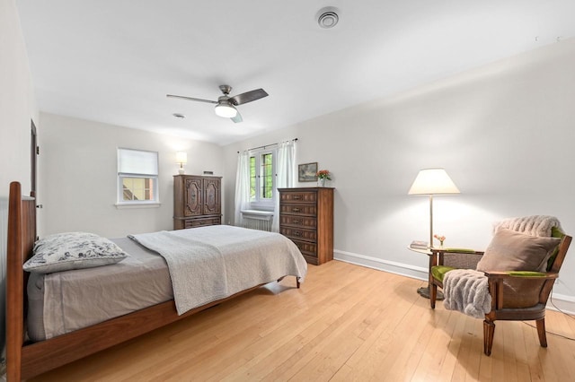 6223 W Wisconsin Ave, Wauwatosa, WI 53213 - bedroom with light wood-style flooring and ceiling fan