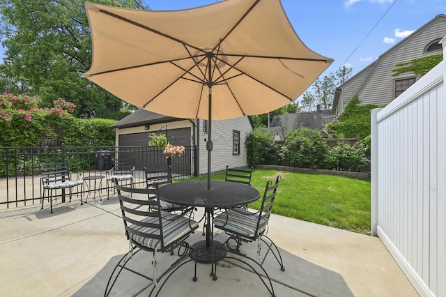 6223 W Wisconsin Ave, Wauwatosa, WI 53213 - view of patio / terrace featuring outdoor dining space and an outdoor structure