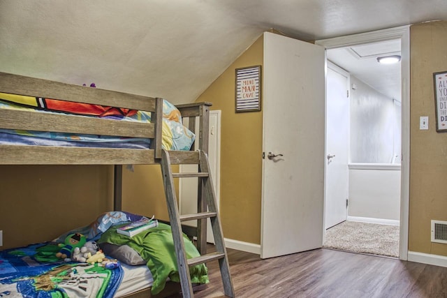 1702 S Douglas St, Appleton, WI 54914 - bedroom featuring wood finished floors and vaulted ceiling