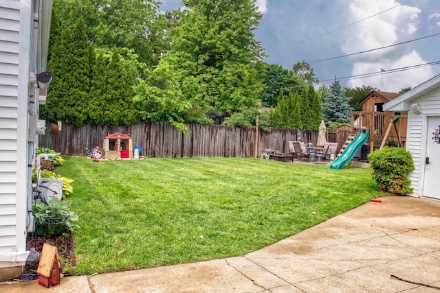 1702 S Douglas St, Appleton, WI 54914 - fenced backyard with a playground and a patio