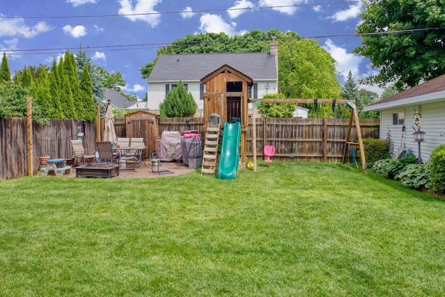 1702 S Douglas St, Appleton, WI 54914 - fenced backyard featuring a playground and a patio
