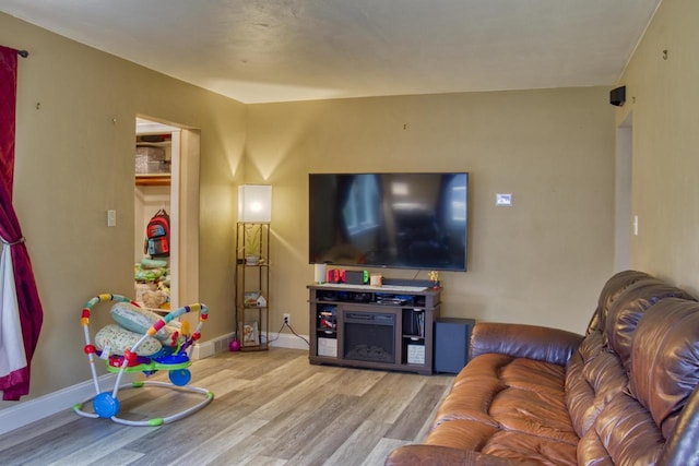 1702 S Douglas St, Appleton, WI 54914 - living room featuring wood finished floors and baseboards