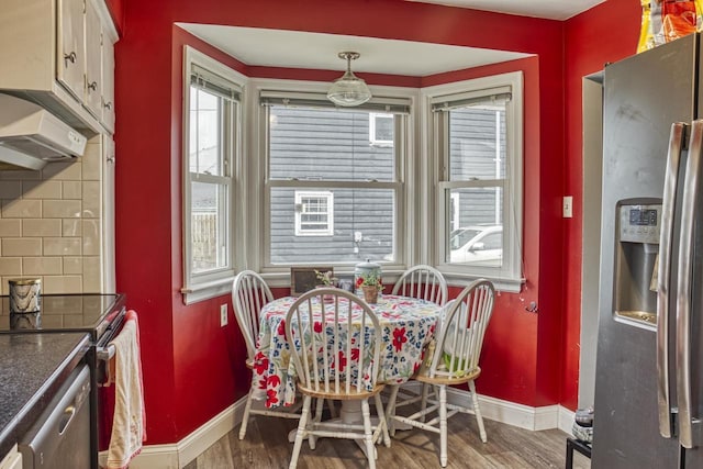 1702 S Douglas St, Appleton, WI 54914 - dining area featuring baseboards and wood finished floors