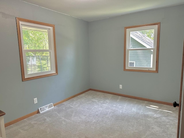 341 Grove St, Lake Mills, WI 53551 - empty room with carpet flooring and baseboards