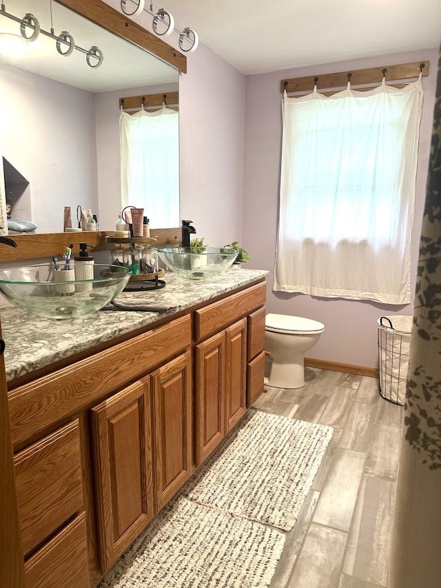 341 Grove St, Lake Mills, WI 53551 - bathroom featuring wood finished floors and vanity