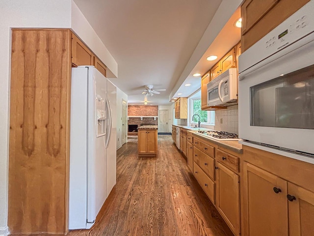 417 Anglesey Rd, Wales, WI 53183 - kitchen featuring white appliances, wood finished floors, decorative backsplash, recessed lighting, and ceiling fan