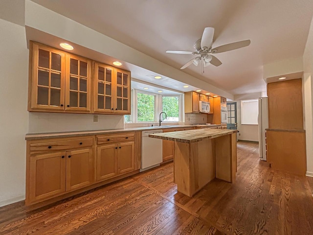 417 Anglesey Rd, Wales, WI 53183 - kitchen with white appliances, a kitchen island, glass insert cabinets, dark wood-style floors, and ceiling fan