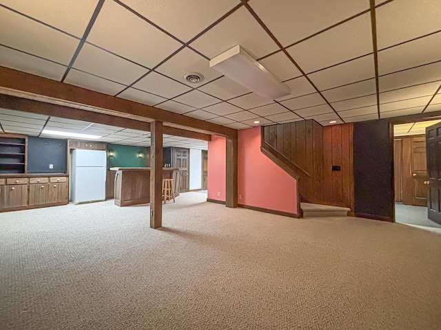 417 Anglesey Rd, Wales, WI 53183 - finished basement with freestanding refrigerator, carpet, a bar, and a paneled ceiling